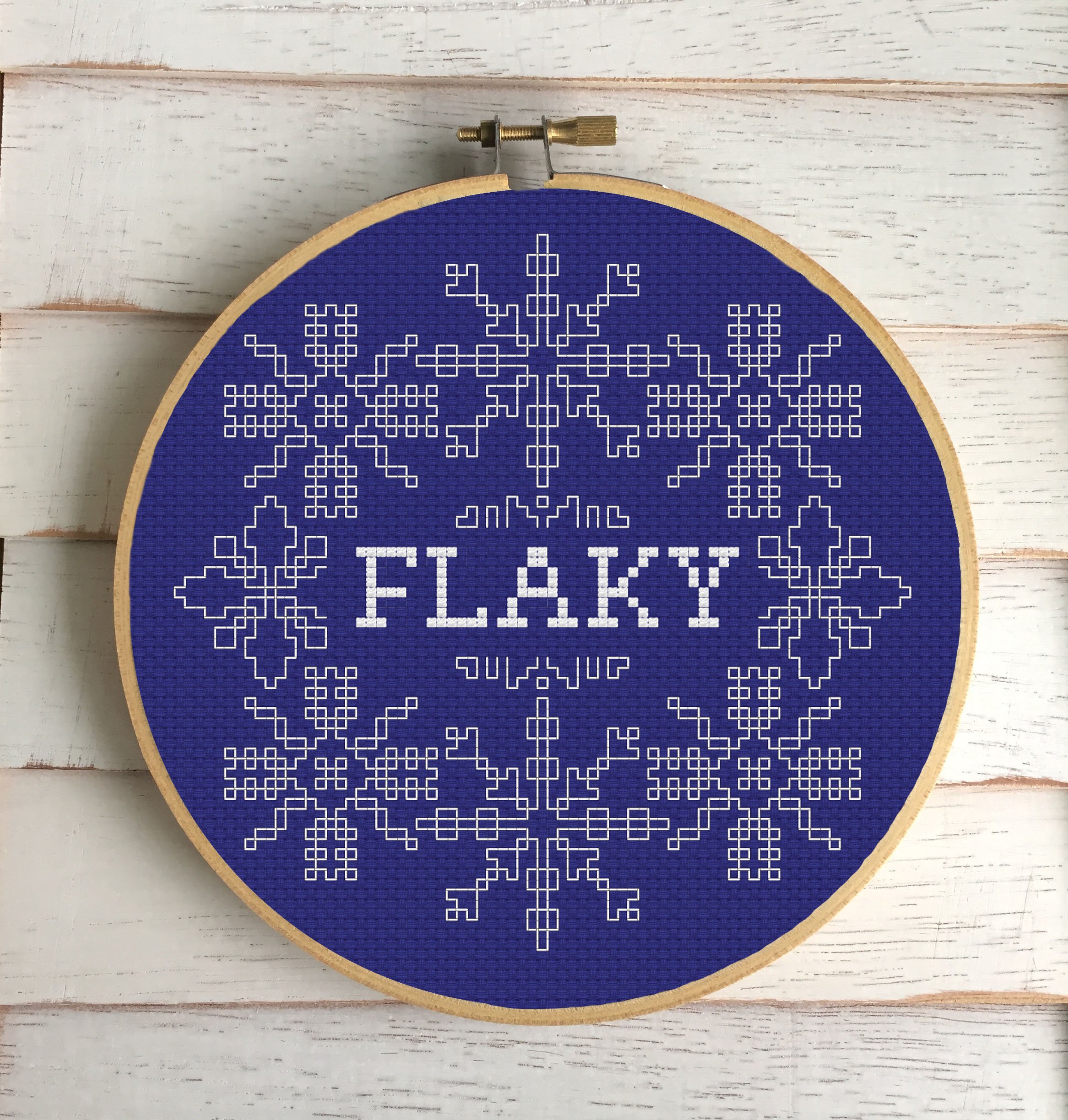 WS Flaky Counted Cross Stitch DIY Kit featuring snowflakes and the word 'FLAKY' in back stitch, complete with all necessary materials.